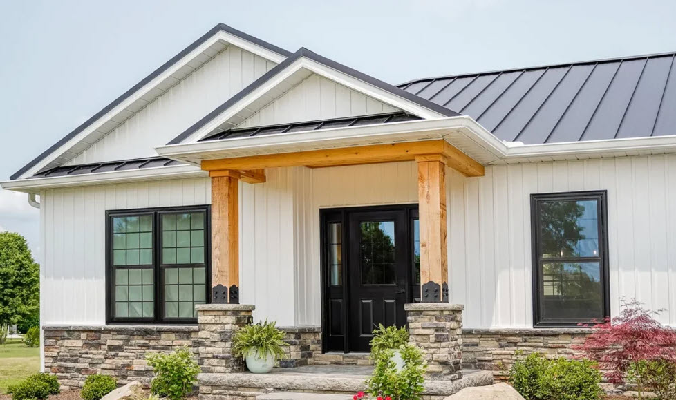 lack exterior replacement windows and black entry door on a modern Minneapolis home.