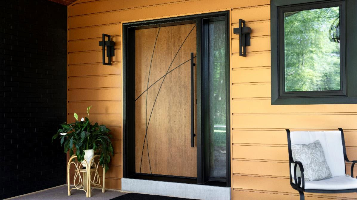 ProVia Signet Cherry Inscribed fiberglass entry door installed on a Minneapolis home with Cider stain, sidelite and black contemporary door pull.